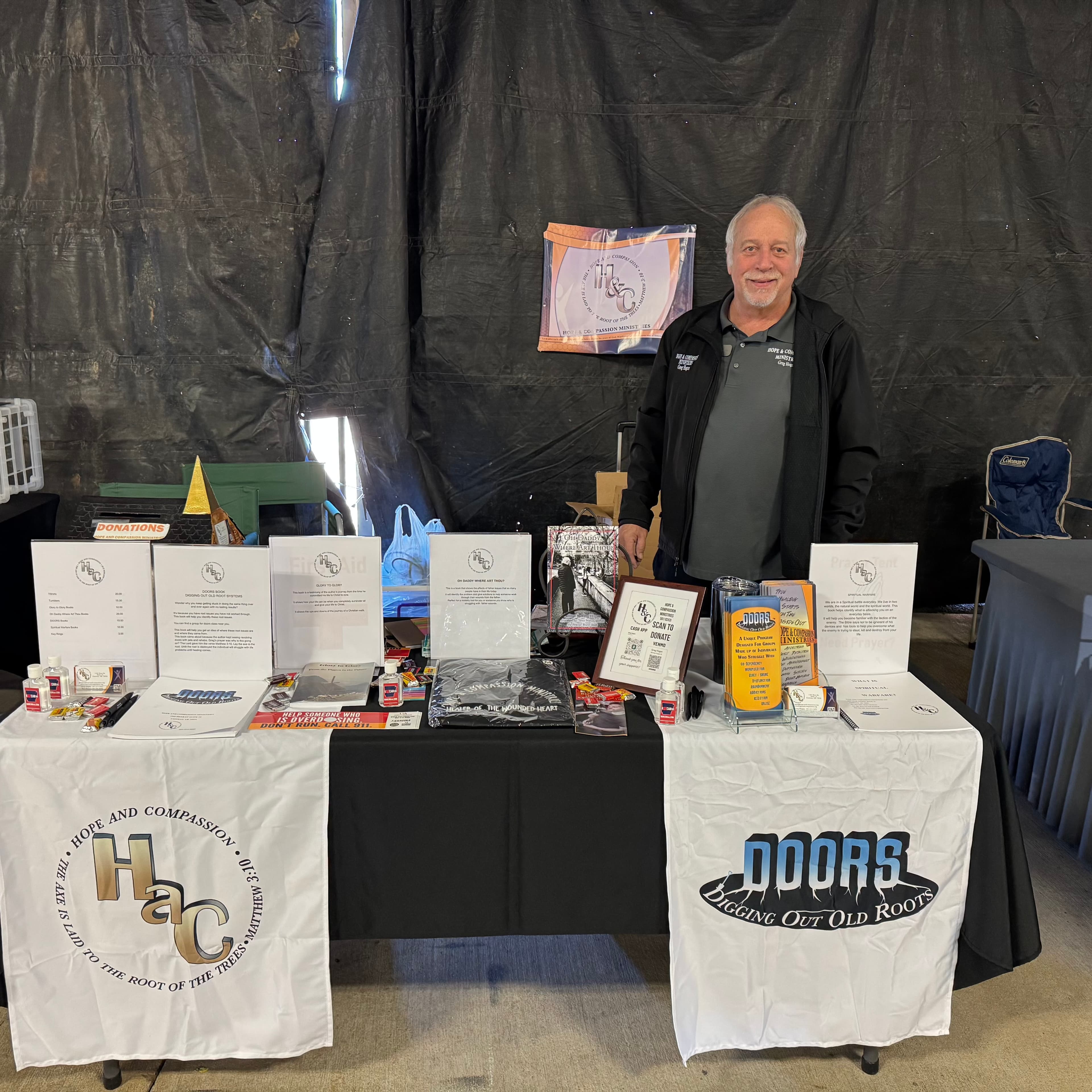 Hope & Compassion Ministries outreach booth at a community event